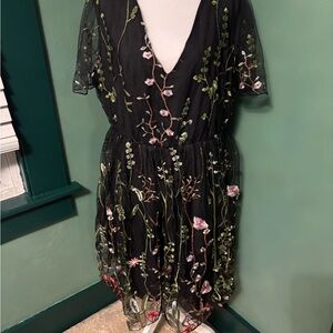 BloomChic Elegant Black Midi Dress with Floral Design